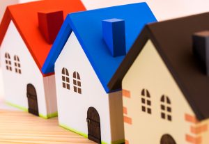 Home concept. Colorful wooden model of house.